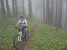 Don riding through the clouds on Hardesty Trail