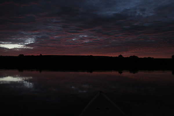 Kayak fishing with watermanatwork.com just before sunrise on a cloudy desert morning