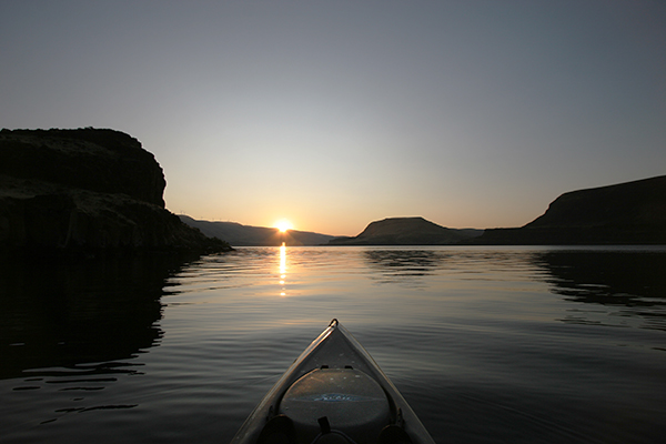 Kayak fishing on the Columbia River at sunrise with watermanatwork.com