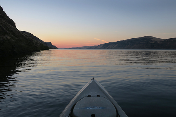 Kayak fishing on the Columbia River at sunrise