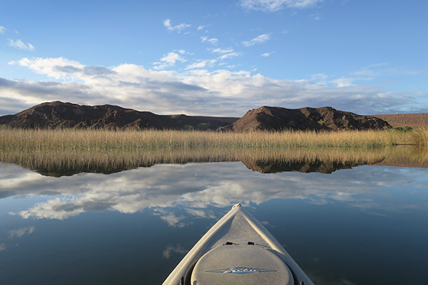 Kayak fishing just after sunrise on the Colorado River