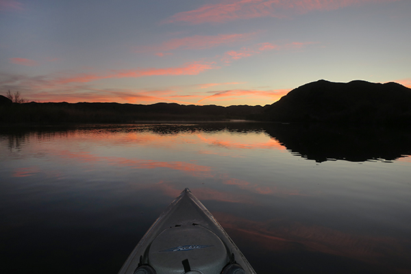 Kayak fishing at dawn on the Colorado River