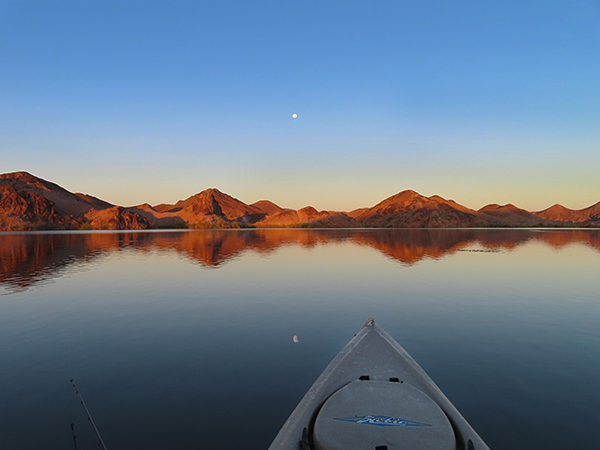 Colorado River at sunrise with a full harvest moon